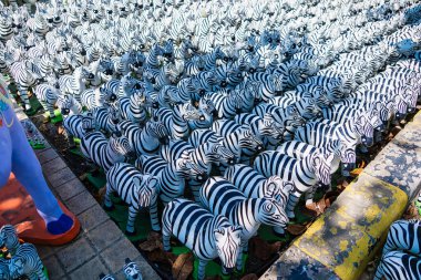 Zebra Statue Used as a Symbolic Offering in Thai Spiritual Shrine for Worship clipart