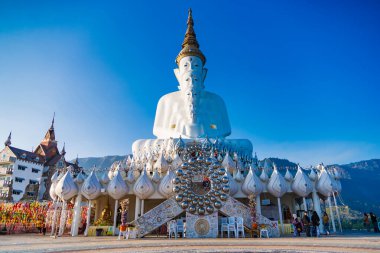 Phetchabun, Thailand - January, 06, 2025 : Majestic White Buddha Statues at Wat Pha Sorn Kaew Temple in Thailand, Surrounded by Beautiful Mountain Scenery and Blue Sky at Phetchabun, Thailand. clipart