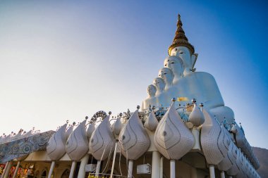 Phetchabun, Thailand - January, 06, 2025 : Majestic White Buddha Statues at Wat Pha Sorn Kaew Temple in Thailand, Surrounded by Beautiful Mountain Scenery and Blue Sky at Phetchabun, Thailand. clipart