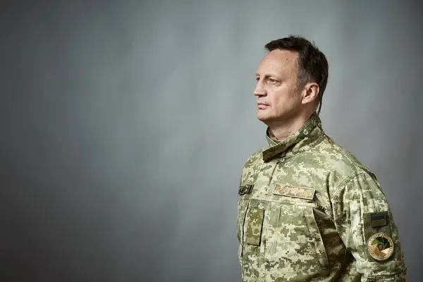 Ukrainian military man, in military uniform. On the sleeve there is an inscription in Ukrainian - Ukrainian military television. On the chest there is an inscription - the armed forces of Ukraine.