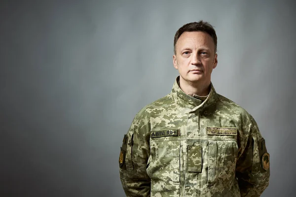 Ukrainian military man, in military uniform. On the sleeve there is an inscription in Ukrainian - Ukrainian military television. On the chest there is an inscription - the armed forces of Ukraine.