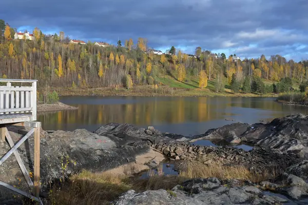 Lake among rocks in Sweden N?mforsen rock carving