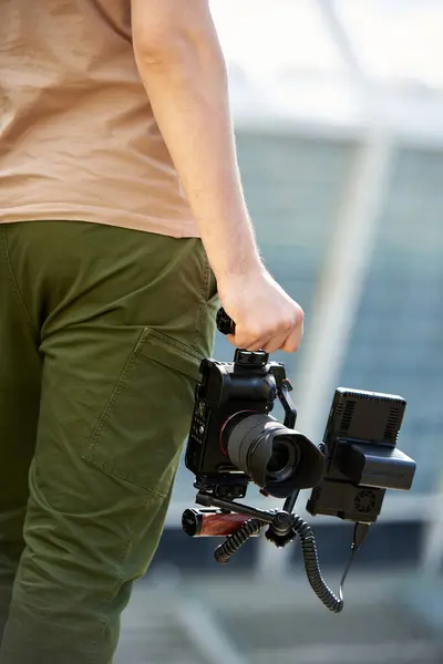 stock image Male videographer with video camera in hand