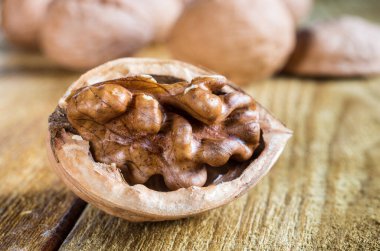 open walnut, grain of walnut, on a wooden table