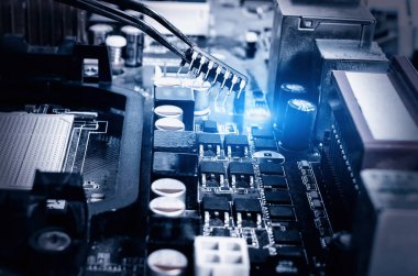installation of the chip by a technician on the motherboard