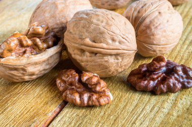 open walnut, grain of walnut, on a wooden table, close up