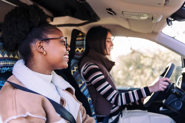 stock image two young women in vacation with best friend in a camper van, concept of adventure and active tourism