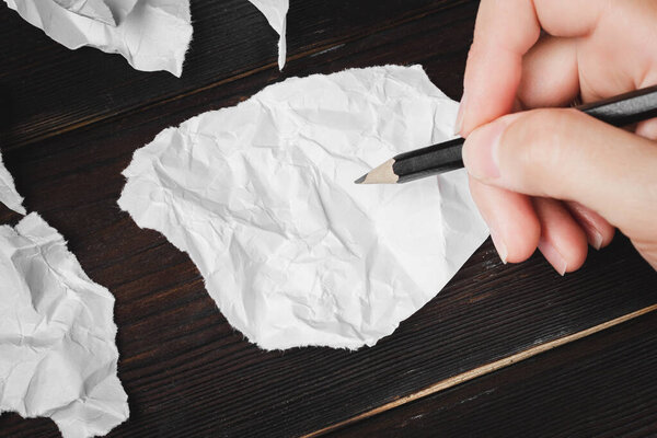 A note on a piece of paper. Pencil in hand. Write a note. High quality photo