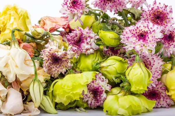 Withered flowers. Withered chrysanthemums. Withered eustoma. Bouquet of withered flowers. High quality photo