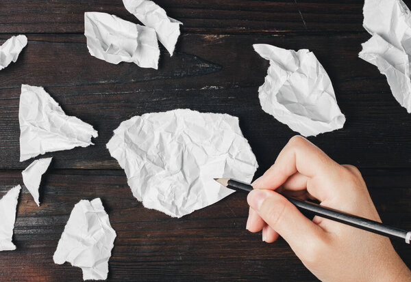 Pencil in hand. Write a note. A note on a piece of paper. High quality photo