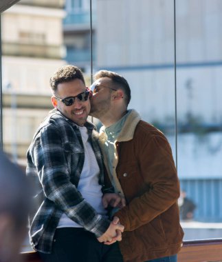 A portrait of happy gay couple outdoors