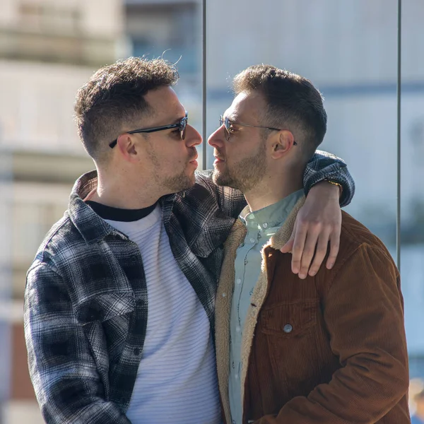 A portrait of happy gay couple outdoors