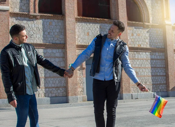 A portrait of happy gay couple outdoors