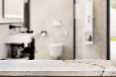 Banyo arkaplanı bulanık, boş mermer bir masa. ürün gösterimi için.