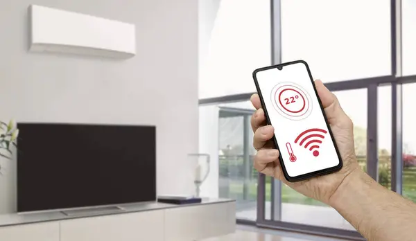 Mobil uygulama ısıyı düzenliyor modern kablosuz ağ denetimi.