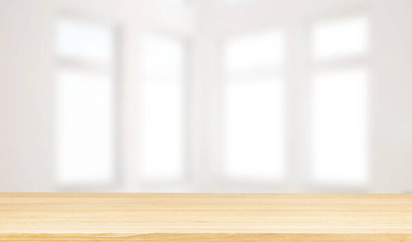 Modern empty room with wooden floor and large white concrete wall