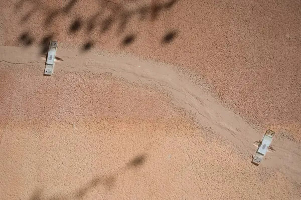 Deep crack in a damaged old plaster wall with plastic mechanical crack meter designed to measure movement across surface cracks and joints