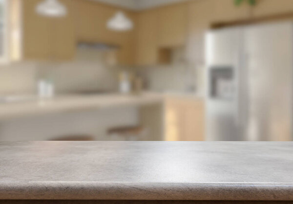 Empty wooden top table with blurred kitchen interior Background. for product display