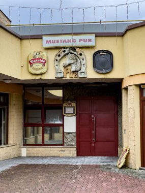 Piestany, Slovakia - 01.29.2025: Beer bar Mustang pub. Facade. clipart