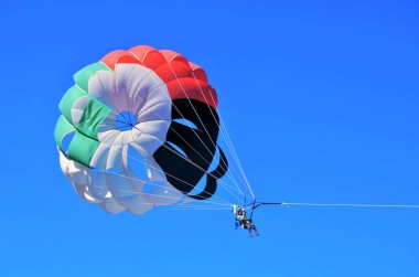 Parasailing show (parascening, paraskiing, parakiting), Fujairah, United Arab Emirates.