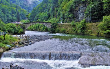 A scenery of Ottoman Castle (Still) bridge over Firtina River, Rize, Turkiye.