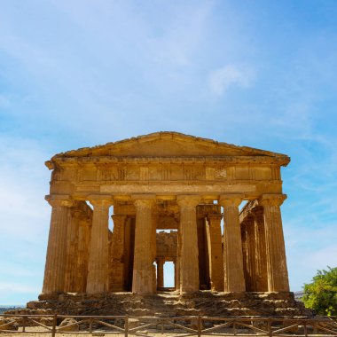 Temple of Concordia, a facade, the front side., The Valley of the Temples in Agrigento, archaeological heritage. Hellenic, Greek Doric architecture in Sicily, Italy, famous tourist place, no people. August 2023. clipart