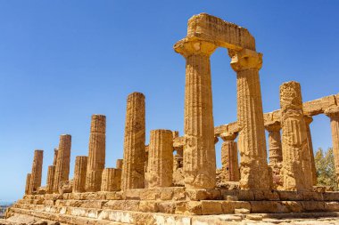 Columns of Temple of Heracles. The Valley of the Temples in Agrigento, archaeological heritage. Hellenic, Greek architecture in Sicily, Italy, famous tourist place, no people. August 2023. clipart