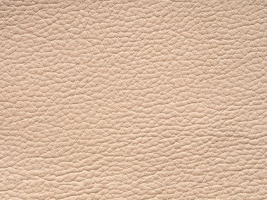 Bej deri dokular. Fotokopi alanı ve üst görünümü olan arkaplan. Hakiki deri örneği hafif tonda yakın çekim. Tasarım için arka plan desenli efekt, döşenmiş mobilya, giysi. Sahte eko deri..