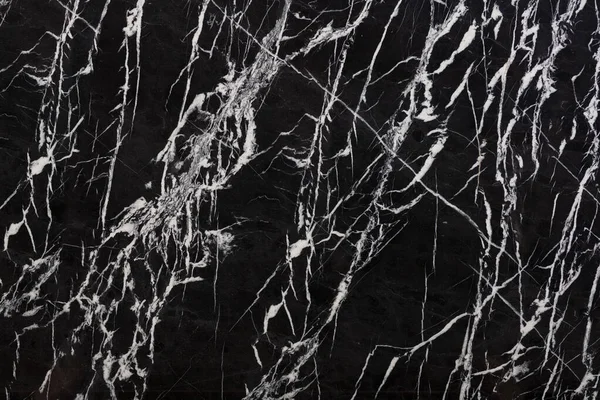 Bianco nero - natural marble stone texture. Dark pattern of marble, photo of slab. Wallpaper of natural granite stone. Closeup grunge surface, matte natural background for ceramic digital tiles