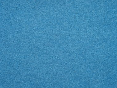 Yumuşak Mavi keçeli kumaş arka plan. Kumaş dokusunun yüzeyi mavi renkte. Metinler, harfler, yamalar ya da diğer sanat eserleri için yumuşak desen. Sanat ve kırtasiye malzemelerinden oluşan tam çerçeve duvar kağıdı.