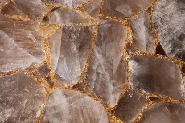 Brown smoky quartz stone slab. Gemstone background. Matt semi precious mineral pattern. Semiprecious texture for ceramic wall, floor digital tiles. Material for interior, exterior design decoration