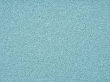 Texture of soft blue felt close-up. Handicraft concept, crafts, DIY, do it yourself. Top view, flat lay, layout, place for text. For shops with goods for creativity, to illustrate master classes