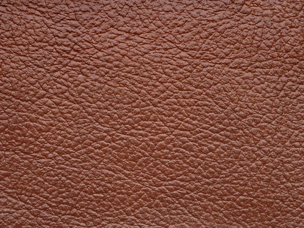 Genuine soft brown leather skin natural with design lines pattern or red abstract background. Genuine leather texture. Use wallpaper or backdrop luxury event, design upholstered furniture, clothing