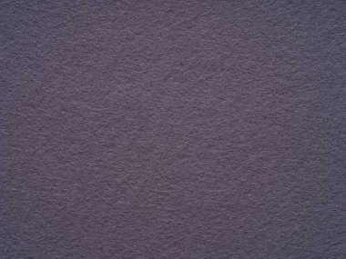 Violet, lilac dark felt, soft material blank texture. Surface of felted fabric texture abstract background. Pattern for text, lettering, patchwork or other art work. Full frame backdrop wallpaper