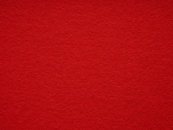 stock image Red felt texture. Saturated background for Christmas desktop, holiday New Year, xmas seasonal decoration, valentin day, text, lettering, patchwork or, party greeting and wedding card element.