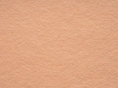 Beige or soft brown blank felt texture closeup. Full frame retro, vintage pattern. Textured wool pattern for shops with goods, creativity to illustrate patchwork master classes with place for text.