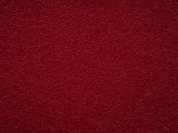 Dark red blank felt texture closeup. Full frame retro, vintage pattern. Top view, layout, place for text. Textured wool pattern for shops with goods, creativity to illustrate patchwork master classes