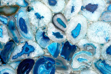 Amazing Colorful Blue Agate Crystal cross section background. Natural translucent slice geode crystal surface, Blue abstract structure slice mineral stone macro. Closeup of a banded Agate specimen