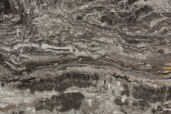 Поверхность гранитного камня. Может использоваться в качестве фона. Фото высокого разрешения
