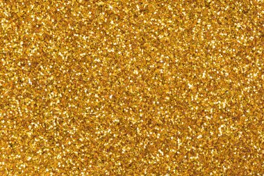 Yeni tarz bir tonda ışıltılı arkaplan, tatil masaüstünüzün bir parçası olarak altın tonda dokularınız. Yüksek çözünürlüklü fotoğraf.