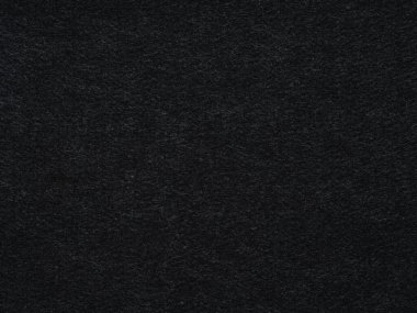Koyu siyah keçeli kalem. Keçeli kumaş dokusunun soyut arka planının yüzeyi. Yüksek çözünürlüklü. Metin, harf, yama ya da diğer sanat eserleri için desen.