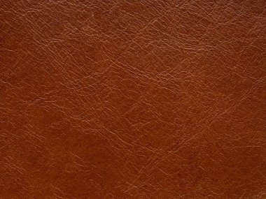 Luxury brown, leather textured surface. Genuine quality empty pattern in dark red tone. Eco rough background. Backdrop blank skin effect for design, upholstered furniture, purses, quality clothes.