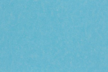 Hafif mavi kağıt arka planı kapat. Yüksek çözünürlüklü fotoğraf.