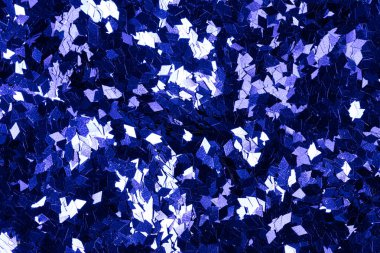 Üstün holografik ışıltı arkaplanı koyu mavi tonda. Yüksek çözünürlüklü fotoğraf.