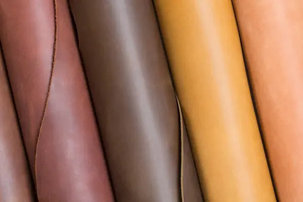 stock image Close up of multicolored vertical rolls of leather. High resolution photo,