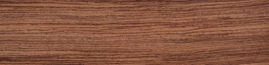 The image displays the natural elegance of Bubinga veneer, noted for its distinctive wave patterns and warm reddish hues that bring a rich, organic feel to any crafted piece clipart