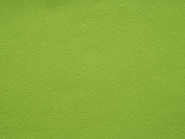 Parlak yeşil keçeli kumaştan oluşan bir resim. Yazın canlı özünü ve yeni büyümenin tazeliğini yansıtıyor.