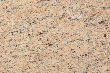 Hafif tonda doğal granit arka plan. Yüksek çözünürlüklü fotoğraf.