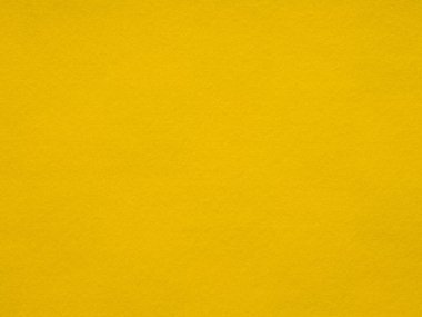 Görüntü, kumaşların yumuşak dokusuna yakın çekim sunan canlı bir altın çubuk yüzeyi gösteriyor. Bu tam kare çekim sıcaklığı, rahatlığı ve el sanatlarının basitliğini çağrıştırıyor.