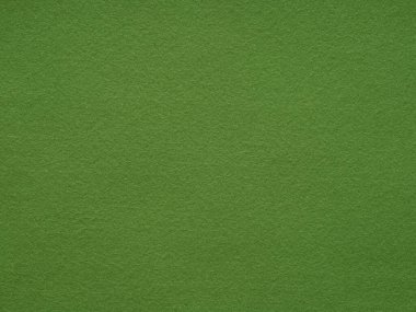 Bu yüksek çözünürlüklü görüntü rahatlatıcı yeşil keçeli yüzey özünü yakalar, sakin ve minimalist bir estetiği tek renk ve dokusuyla somutlaştırır.